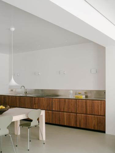 a kitchen with a table and chairs and a counter at Piso GV 65 in Logroño