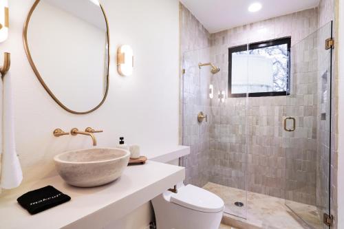 a bathroom with a sink and a shower at Majestic Oak - Luxury, Billiards Room & Pool in San Antonio