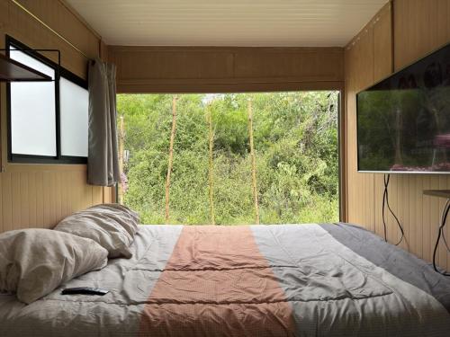 Katil atau katil-katil dalam bilik di Tiny House en Santiago NL