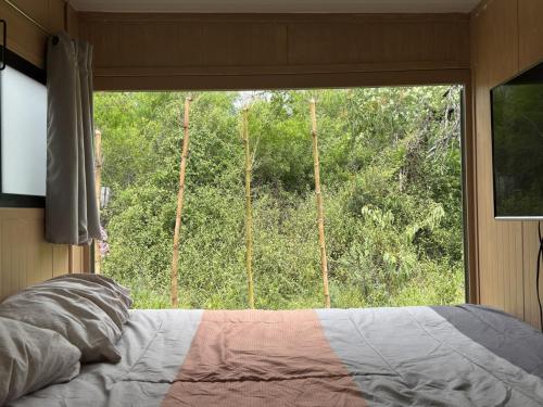 Katil atau katil-katil dalam bilik di Tiny House en Santiago NL