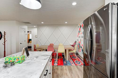 a kitchen and dining room with a table and chairs at indy dreamhouse lux stay in Greenwood