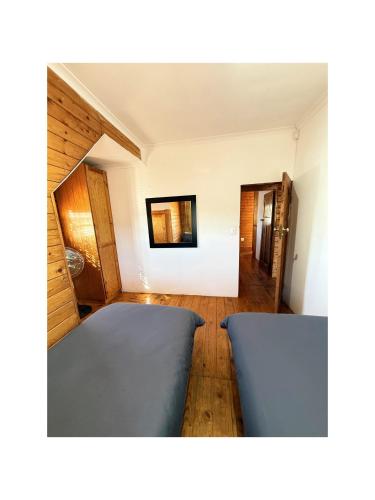 a room with two blue beds in a room at Rihla Residences - Civic Road in Cape Town