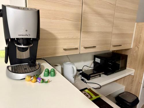 a kitchen counter with a coffee maker and a microwave at Old Town in Kapfenberg