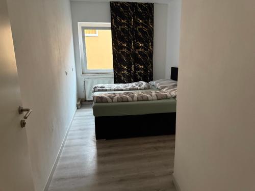 a room with two beds and a window at Old Town in Kapfenberg