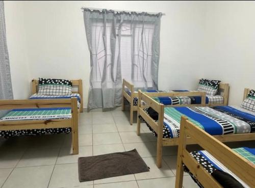 Postel nebo postele na pokoji v ubytování Sir Garnet Inn