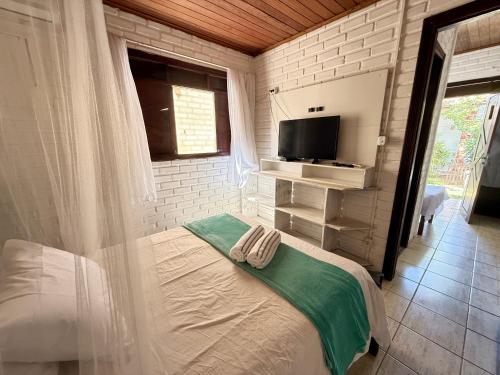 Ένα ή περισσότερα κρεβάτια σε δωμάτιο στο Oceana Suites Villas de Tibau