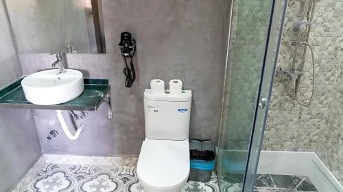 a bathroom with a toilet and a sink and a shower at CASA DEL TITO in Oulad Akkou