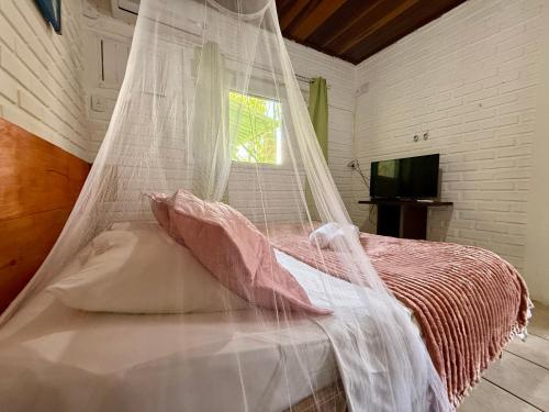 Ένα ή περισσότερα κρεβάτια σε δωμάτιο στο Oceana Suites Villas de Tibau