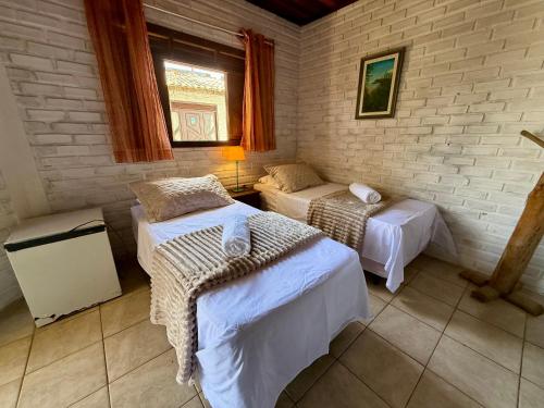 Ένα ή περισσότερα κρεβάτια σε δωμάτιο στο Oceana Suites Villas de Tibau
