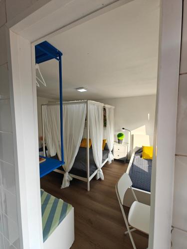 a room with two bunk beds and a couch at Eastern in Tilburg