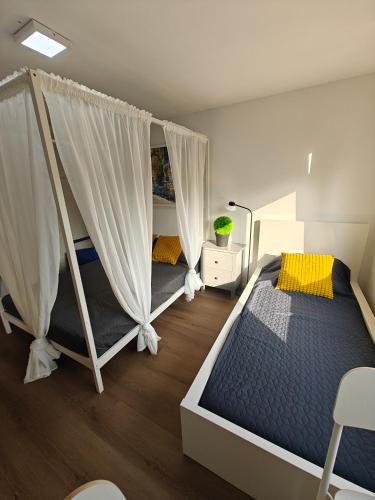 a bedroom with two bunk beds with curtains at Eastern in Tilburg