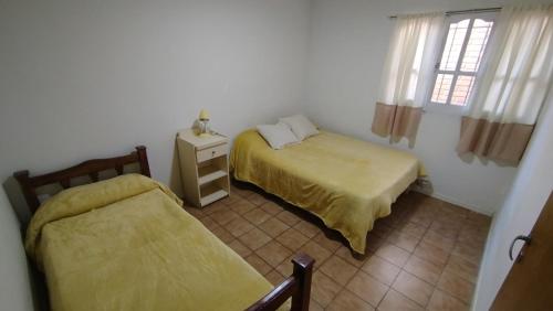 Postel nebo postele na pokoji v ubytování Microcentro San Rafael