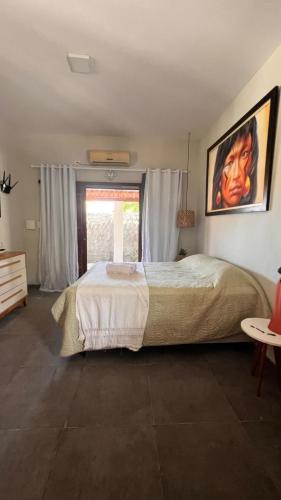 Ένα ή περισσότερα κρεβάτια σε δωμάτιο στο Chalé da Costa Branca