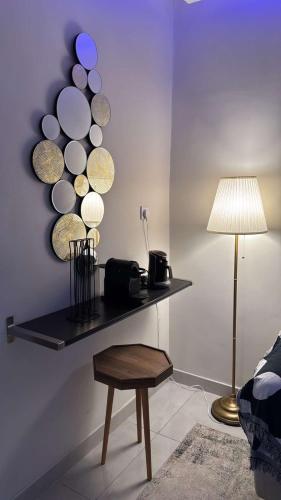 a room with a shelf with plates on the wall at شقة غرفة وصالة in Al Khobar
