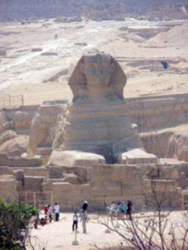 a group of people standing in front of a statue at Pyramids View Inn in Cairo