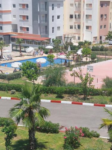 a view of a resort with a swimming pool at Magnifique Appart Tanger Vue Mer Plage à 100m Calme et Nature in Tangier