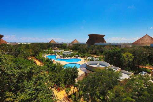 an aerial view of a pool at a resort at Hotel Mundo Maya Tulum in Tulum