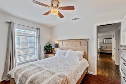 a bedroom with a bed with a ceiling fan at Charming West Palm Beach Home in West Palm Beach