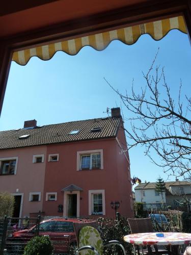 a red building in front of a building at Pension Villa Marit in Prague