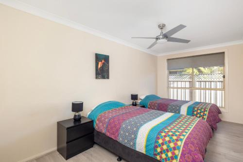 Postel nebo postele na pokoji v ubytování Pawprints