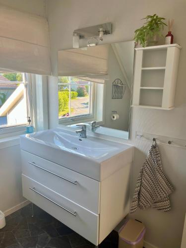a bathroom with a sink and a mirror at Kronstad in Alta