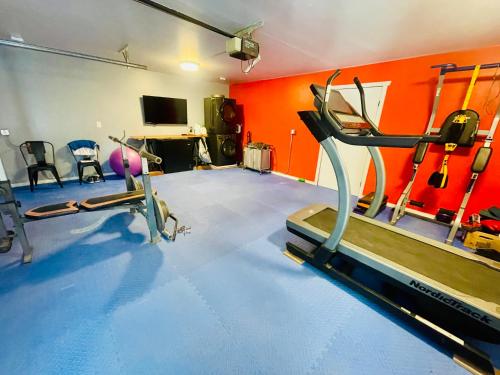 a gym with two tread machines in a room at Sequoia Pine View Trailer Featured on HGTV in Wofford Heights