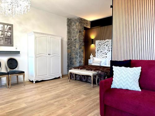 a living room with a bed and a couch at FORTUNA ORO Luxury Stay in Verona