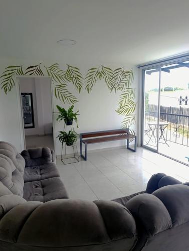 a living room with a couch and a heart wall at Finca Andalucía in San Joaquín