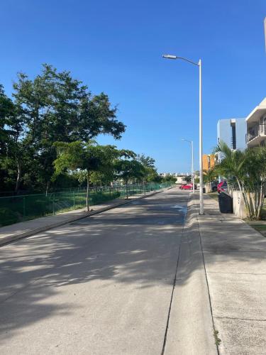 an empty street with a street light on the road at Ubicado en coto privado a 5km de Nuevo Vallarta in Mezcales
