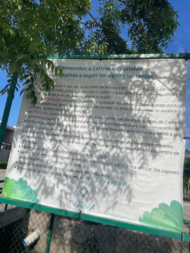 a sign on a fence with a tree in the background at Ubicado en coto privado a 5km de Nuevo Vallarta in Mezcales