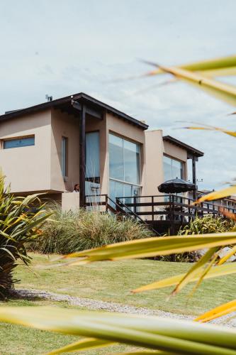 a house with a view of it at Casa Pampa Cabañas in Chapadmalal