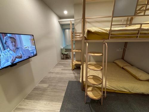 Postel nebo postele na pokoji v ubytování Formosa 101 Taipei Main Branch