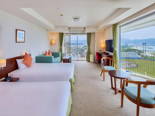 Ένα ή περισσότερα κρεβάτια σε δωμάτιο στο Hotel Yugaf Inn Okinawa