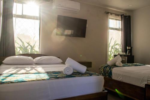 Postel nebo postele na pokoji v ubytování Hotel Uvita Forest
