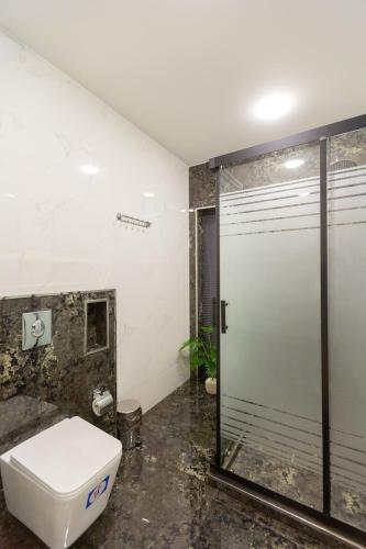 a bathroom with a toilet and a shower at Caspian Colorful Villas in Lankaran