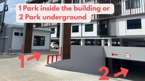 a building with a parking lot with arrows pointing towards a building at Lub Sabai in Yala