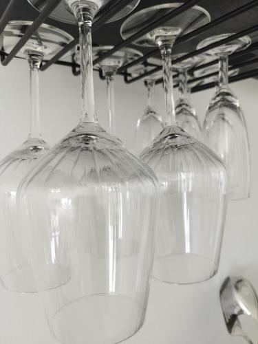 a row of wine glasses sitting on top of a counter at Nature bay in Pointe-à-Pitre