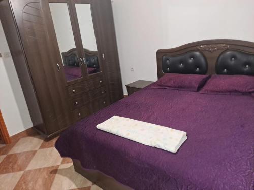 Una cama o camas en una habitación de Vue panoramique sur plage sfiha