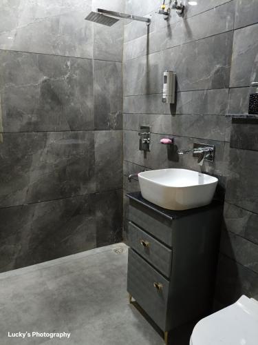 a bathroom with a sink and a toilet at BELLA VISTA Homestay BNB in Zirakpur