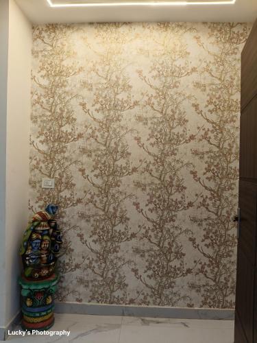 a wall with a painting of trees on it at BELLA VISTA Homestay BNB in Zirakpur