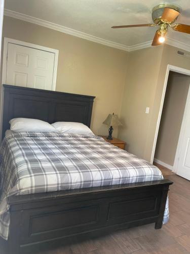 a bedroom with a bed and a ceiling fan at Studio Full kitchen private gated yard Arts Roosevelt row ASU convention ctr Downtown Phx in Phoenix
