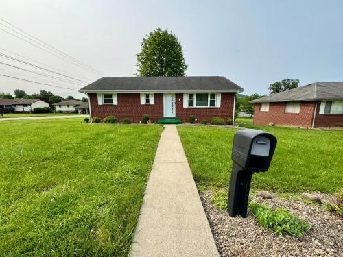 a mailbox sitting in the grass in front of a house at Bridgeport House WV, Close to UHC, FBI, The Bridge Complex in Bridgeport
