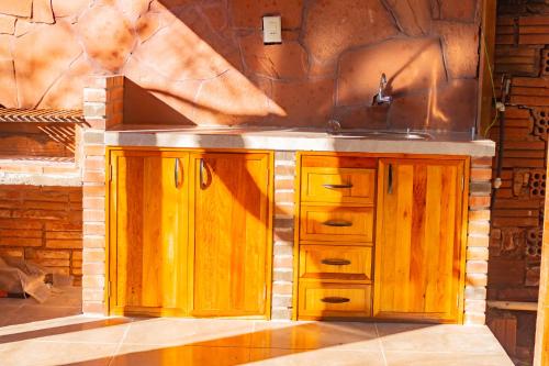 a kitchen counter with a sink and a sink at Cabaña Antonella by Renty in Encarnación
