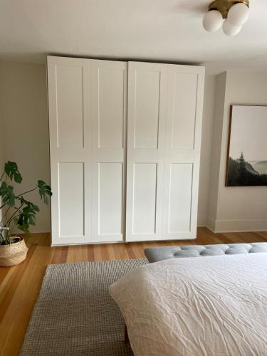 a bedroom with a large white closet at Bright, Spacious Home with Lake & Mountain Views, Walk to Beach in Nelson