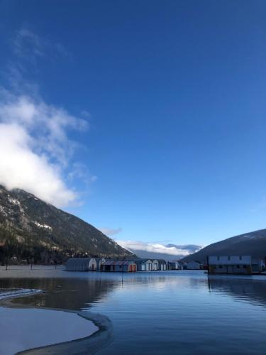 a large body of water with mountains in the background at Bright, Spacious Home with Lake & Mountain Views, Walk to Beach in Nelson