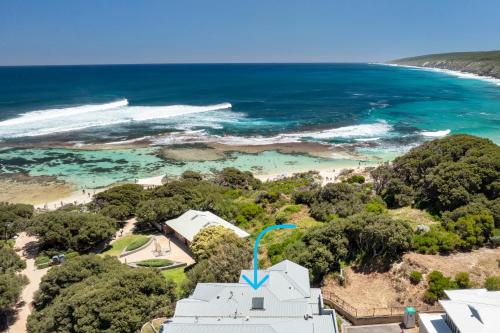 an aerial view of a white building next to the beach at Sunset and Surfside in Yallingup