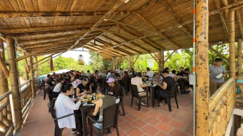 a large group of people sitting at tables in a restaurant at Hotel Sol del Desierto in Villavieja