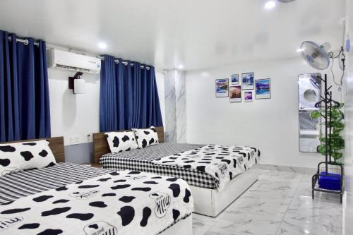 Cama o camas de una habitación en Cat Ba Santorini Homestay