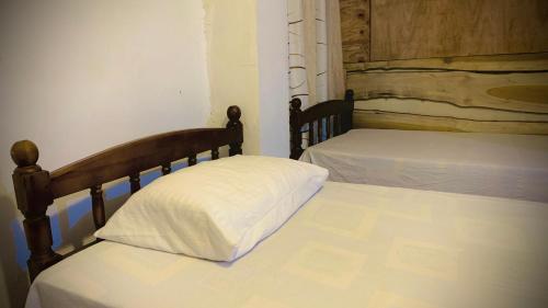 Ένα ή περισσότερα κρεβάτια σε δωμάτιο στο Nalinda's Homestay