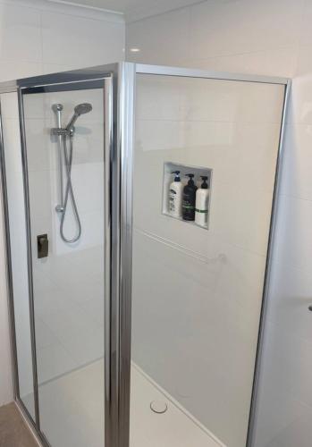 a shower in a bathroom with a glass shower stall at Beach House Getaway 2 in Smiths Beach